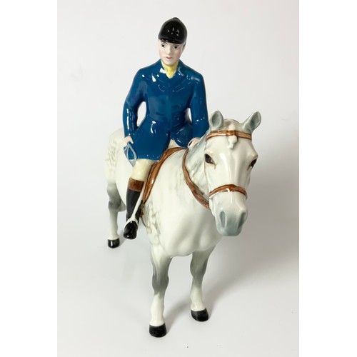 96 - RARE BESWICK HUNTSMAN WEARING BLUE JACKET ON GREY HORSE MODEL NO 1501 21cm  TALL
Please note, we bel... 