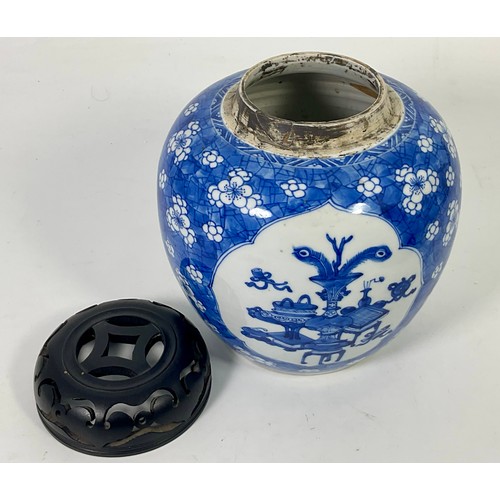 127 - A CHINESE BLUE AND WHITE GINGER JAR DECORATED WITH 3 PANELS HAVING PIERCED HARDWOOD COVER ON A HARDW... 