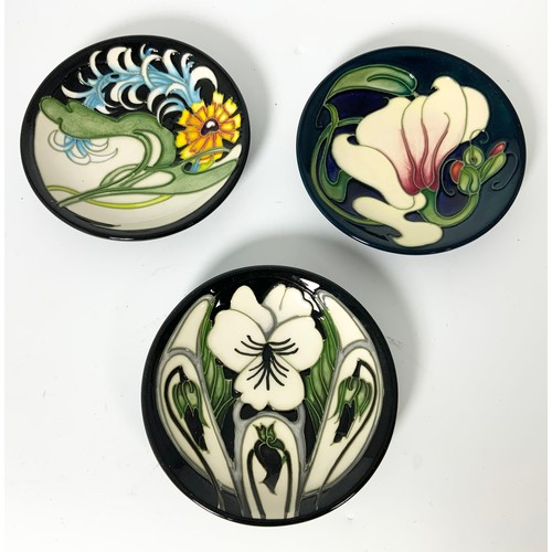 57 - A COLLECTION OF 9 MOORCROFT PIN TRAYS DESIGNS INCLUDED ARE ANEMONE TRIBUTE/MEMORY LANE/TRIPLE CHOICE... 