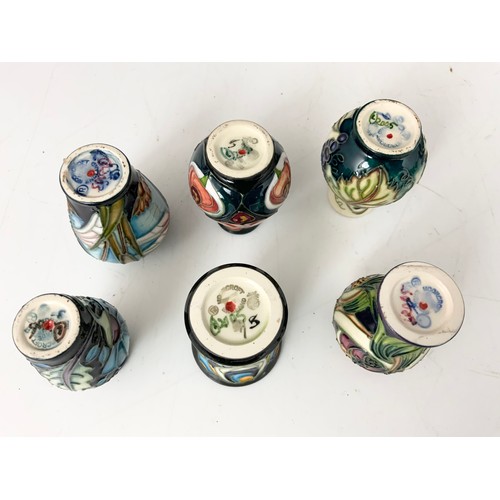 70 - A COLLECTION OF 10 MOORCROFT MINIATURE VASES & 2 GINGER JARS ALL FACTORY SECONDS