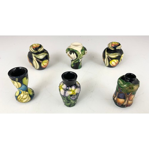 70 - A COLLECTION OF 10 MOORCROFT MINIATURE VASES & 2 GINGER JARS ALL FACTORY SECONDS