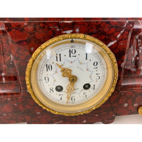 284 - IMPRESSIVE FRENCH CLOCK GARNITURE WITH A FRENCH RED MARBLE CLOCK MOUNTED WITH A CHERUB AND TWO RED M... 