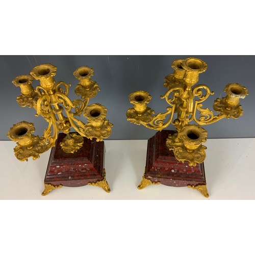 284 - IMPRESSIVE FRENCH CLOCK GARNITURE WITH A FRENCH RED MARBLE CLOCK MOUNTED WITH A CHERUB AND TWO RED M... 