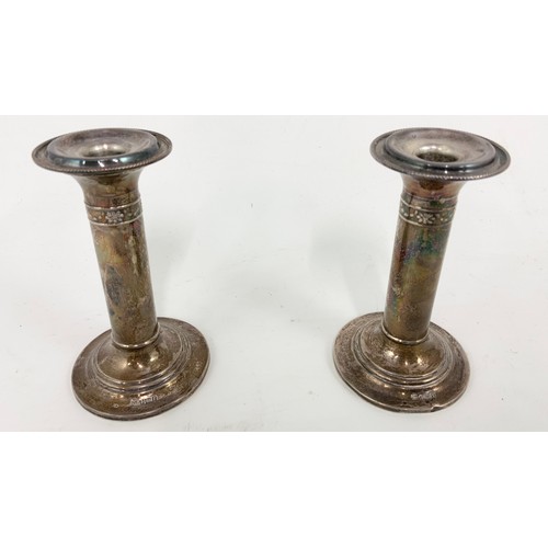 409 - PAIR OF SILVER CANDLESTICKS 14cm TALL