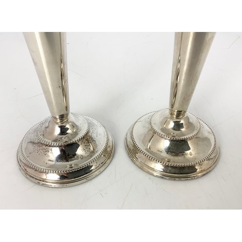 404 - PAIR OF LOADED SILVER CANDLE STICKS 18cm TALL