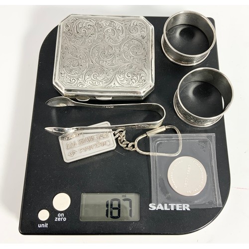 362 - PAIR OF SILVER SERVIETTE RINGS, TONGS, A SILVER CIGARETTE CASE, A SILVER INGOT AND A COMMEMORATIVE C... 