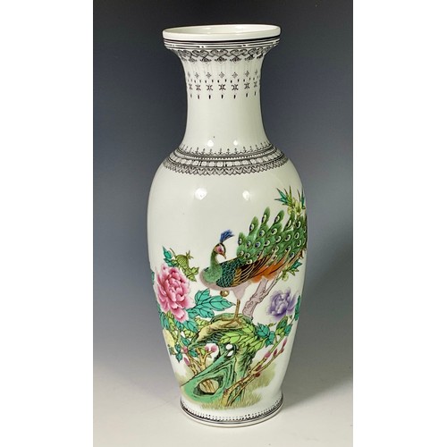 183 - ORIENTAL PORCELAIN BALUSTER VASE DECORATED WITH EXOTIC BIRDS AND SCRIPT, APPROX. 22cm