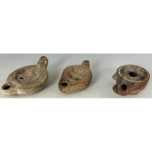 201 - THREE TERRACOTTA ROMAN OIL LAMPS