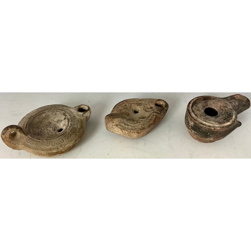 201 - THREE TERRACOTTA ROMAN OIL LAMPS