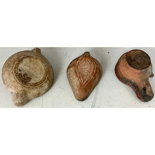 201 - THREE TERRACOTTA ROMAN OIL LAMPS