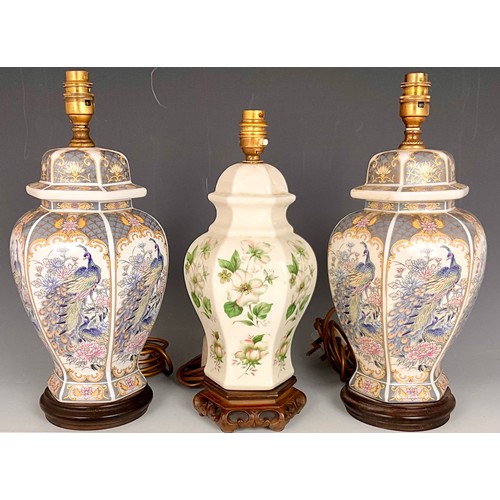 268 - PAIR OF ORIENTAL STYLE CERAMIC LAMP BASES WITH PEACOCK DEPICTION T/W ANOTHER SMALLER LAMP BASE