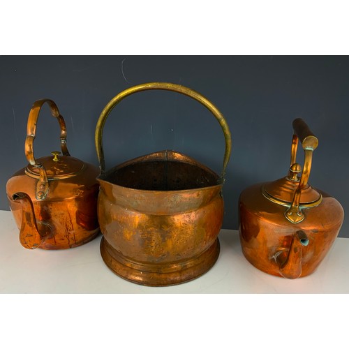 320 - TWO COPPER KETTLES AND A COAL HELMET