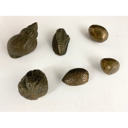 321 - CAST METAL NUTS AND A SHELL