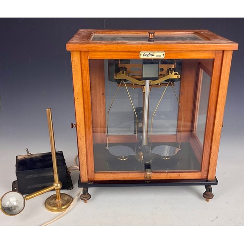 329 - SET OF OERTLING SCIENTIFIC SCALES IN A GLAZED CASE WITH ACCESSORIES