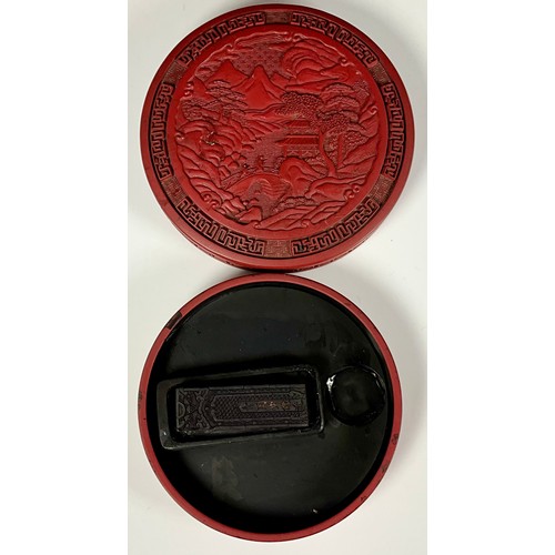 375 - ROUND CINNABAR BOX WITH RELIEF DECORATION AND CONTENTS. Approx. 14cm Dia.