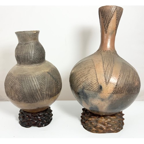 376 - 2 AFRICAN GOURD VASES WITH INCISED DECORATION WITH HARDWOOD STANDS