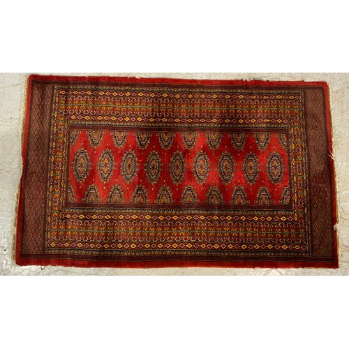 734 - RED GROUND RUG 161cm x 98cm