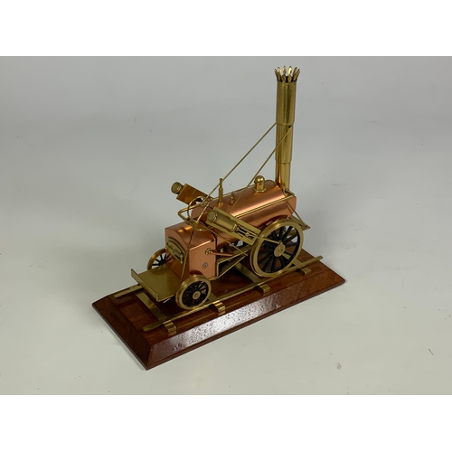 477 - PLINTHED COPPER & BRASS MODEL OF STEPHENSONS ROCKET “APPROX 0 GAUGE”