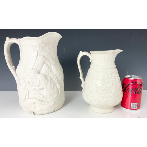 176 - TWO RELIEF DECORATED JUGS, ONE BEARING BRITISH REGISTRATION MARK, THE OTHER A/F