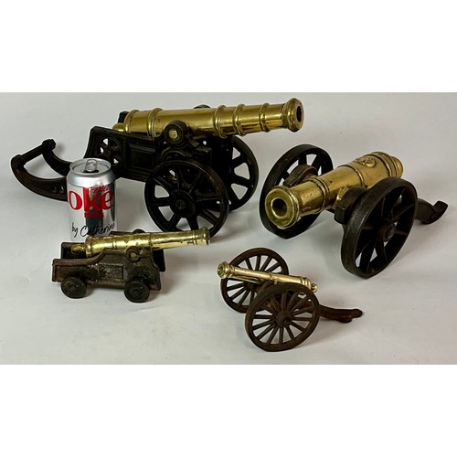 296 - 2 LARGE AND 2 SMALL BRASS CANNONS