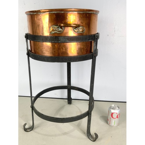 293 - COPPER PLANTER ON WROUGHT IRON STAND 63cm TALL