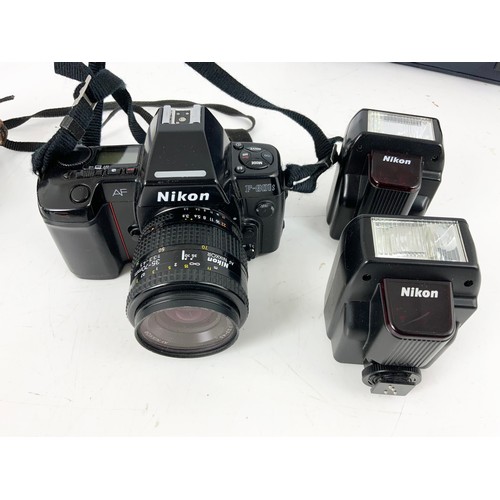 386 - THREE NIKON 35MM CAMERA BODIES AND LENSES INCLUDING 801S (2) AND 801