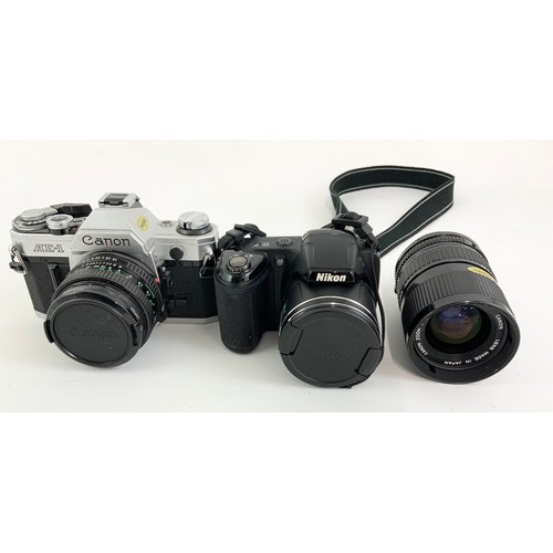 387 - CAMERAS AND ACCESSORIES INC. CANON AE-1 SLR WITH LENSES, NIKON COOLPIX L320 AND VARIOUS TRIPODS AND ... 