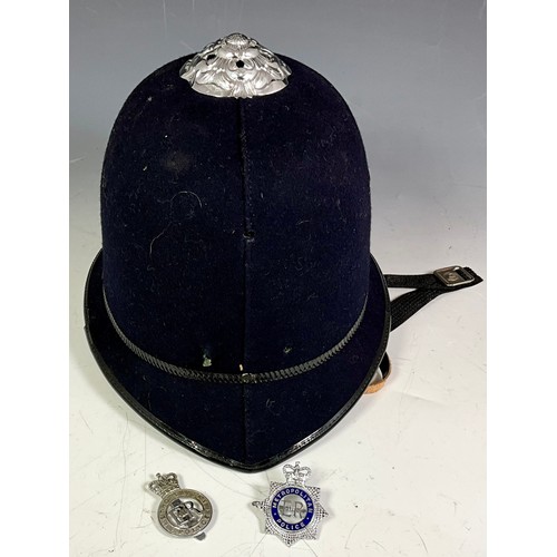 448 - A POLICEMANS HELMET, A BOXED BOWLER HAT, AND A 'JOHN B STETSON COMPANY' STETSON, AND AN AUSTRALIAN H... 