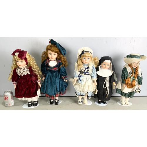 438 - A COLLECTION OF 8 DOLLS  WITH 5 ON STANDS