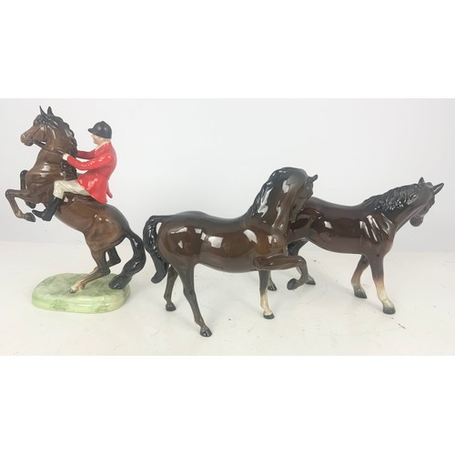 166 - BESWICK MODEL OF HUNTSMAN ON REARING HORSE  868, A BESWICK HORSE MODEL AND ANOTHER HORSE MODEL NO BA... 