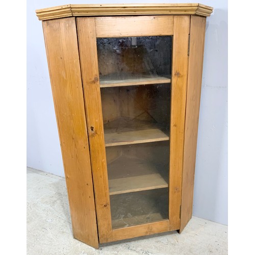 619 - STRIPPED PINE GLAZED CORNER CUPBOARD 111cm TALL