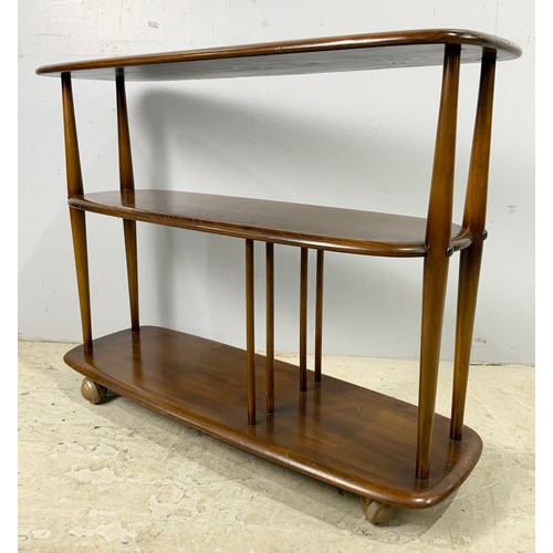 685 - 1960’S ERCOL DARK WOOD WINDSOR 361 BABY GIRAFFE THREE TIER BOOKCASE TROLLEY WIDTH 91cm