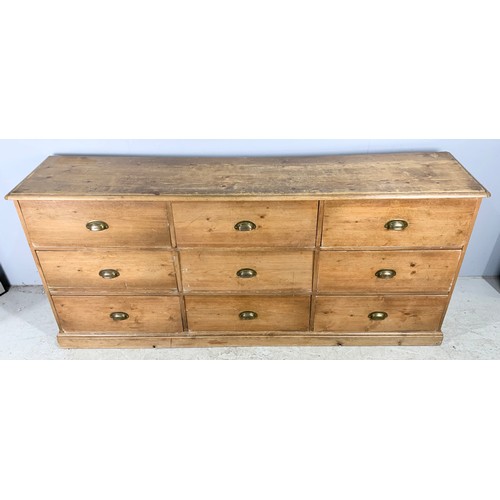 680 - PINE BANK OF 9 LARGE DRAWERS WIDTH 200cm EACH DRAWER APPROXIMATELY 62cm x 40cm x 24cm