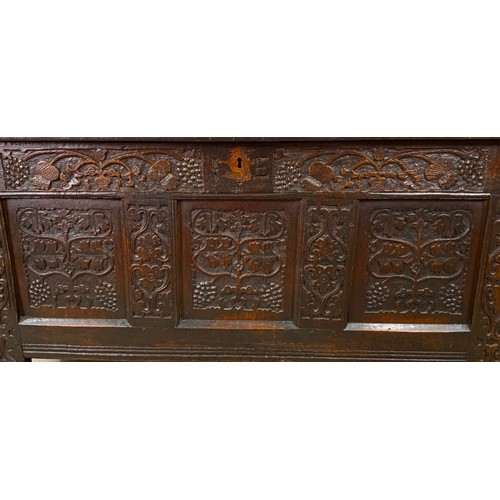 617 - CARVED OAK COFFER HIGHLY CARVED,  4 PANELS TO TOP AND 3 TO BASE