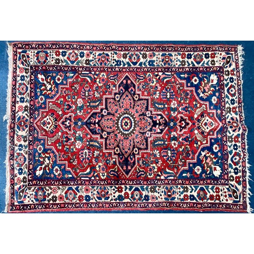 744 - A PERSIAN BAKHTIAR RUSSET RED GROUND RUG. Approx. 220cm x 160cm