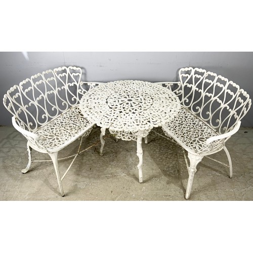 564 - TWO CAST 2 SEATER GARDEN BENCHES WITH A SIMILAR TABLE 80cm DIAMETER