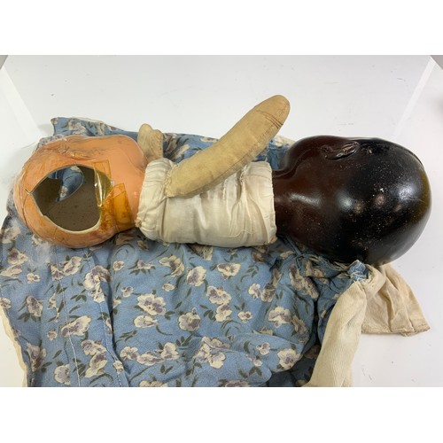 52 - A VERY UNUSUAL TWO HEADED DOLL, APPROX 30 CM LONG, WHITE HEAD AND BLACK HEAD, SOME DAMAGE AS SHOWN