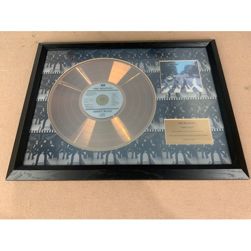 63 - 2 FRAMED WALL HANGINGS INC LIMITED EDITION OF 1500 BEATLES ABBEY ROAD DISC  & VARIOUS MINIATURE WOOD... 