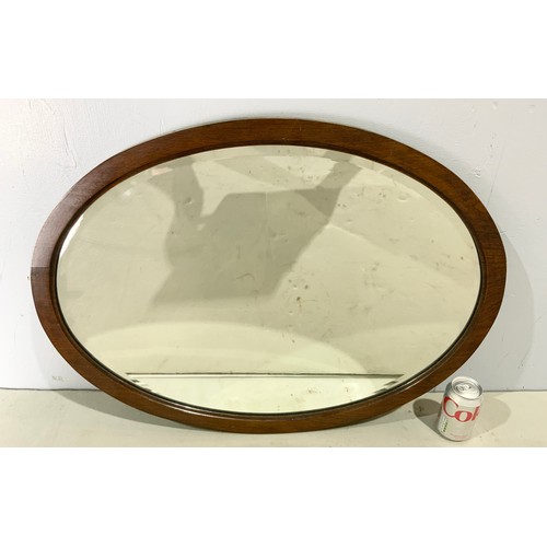 67 - OVAL BEVELLED MIRROR IN MAHOGANY  FRAME  MIRROR 69cm x 49cm