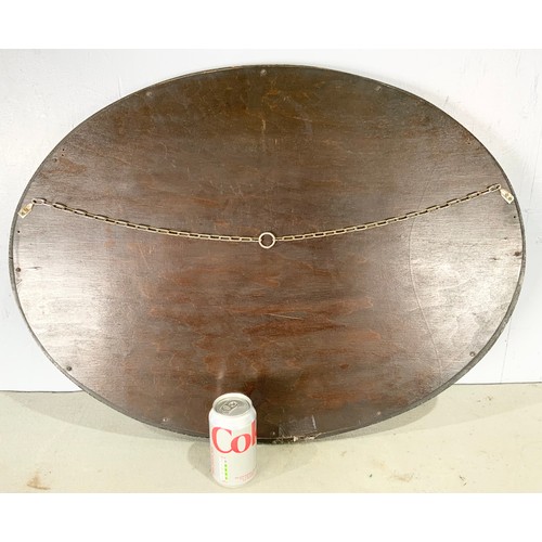 67 - OVAL BEVELLED MIRROR IN MAHOGANY  FRAME  MIRROR 69cm x 49cm