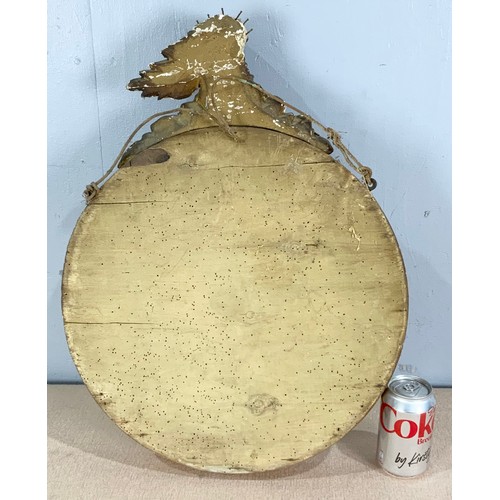 75 - CONVEX GILT FRAME MIRROR WITH MUSKET BALL AND A EAGLE FINIAL  DECORATION AF 43cm DIAMETER