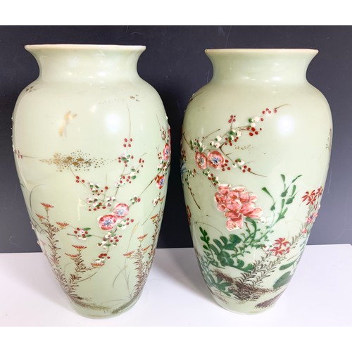 173 - PAIR OF ORIENTAL CELADON GROUND VASES WITH EMBOSSED  BIRD & FLORAL DECORATION 30cm TALL