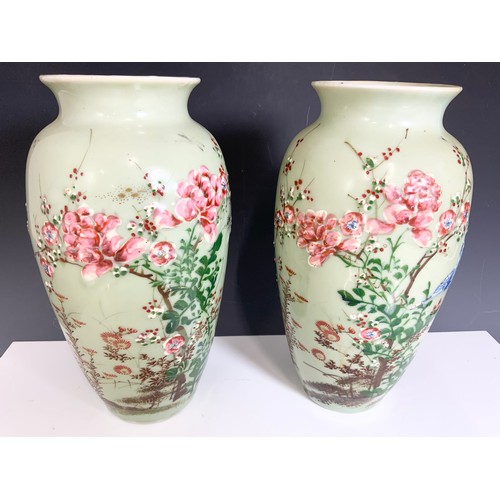 173 - PAIR OF ORIENTAL CELADON GROUND VASES WITH EMBOSSED  BIRD & FLORAL DECORATION 30cm TALL