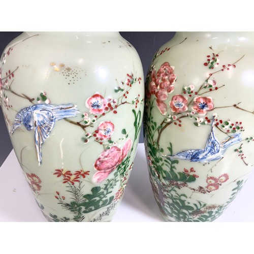 173 - PAIR OF ORIENTAL CELADON GROUND VASES WITH EMBOSSED  BIRD & FLORAL DECORATION 30cm TALL