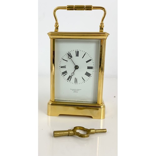 299 - GOLDSMITHS COMPANY, LONDON FOUR GLASS CARRIAGE CLOCK WITH KEY 13.5cm TALL NOT INCLUDING HANDLE