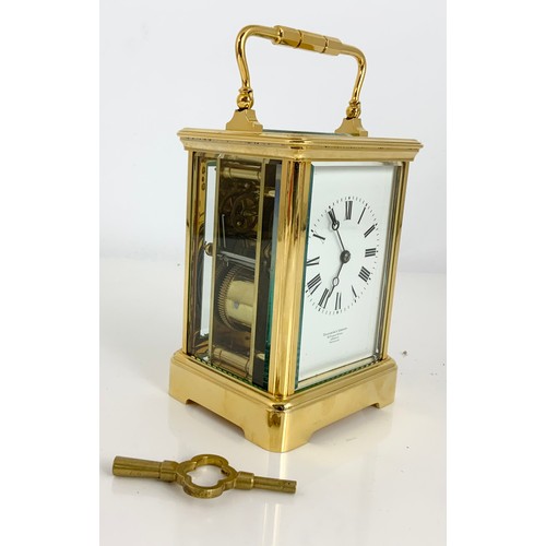 299 - GOLDSMITHS COMPANY, LONDON FOUR GLASS CARRIAGE CLOCK WITH KEY 13.5cm TALL NOT INCLUDING HANDLE