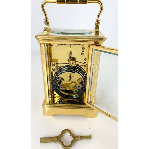 299 - GOLDSMITHS COMPANY, LONDON FOUR GLASS CARRIAGE CLOCK WITH KEY 13.5cm TALL NOT INCLUDING HANDLE