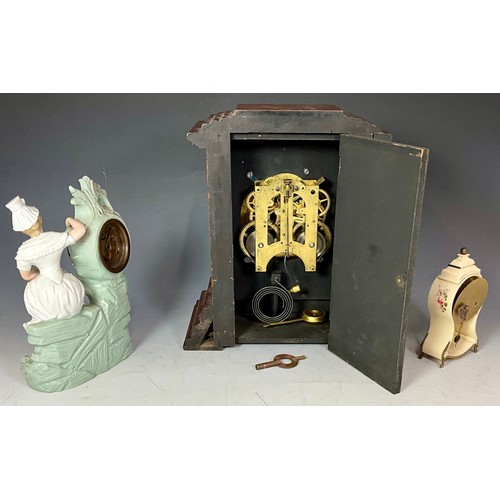 296 - THREE MANTEL CLOCKS - A 19TH CENTURY FRENCH FIGURAL PORCELAIN CLOCK, AN ANTIQUE GERMAN STAG BAKELITE... 