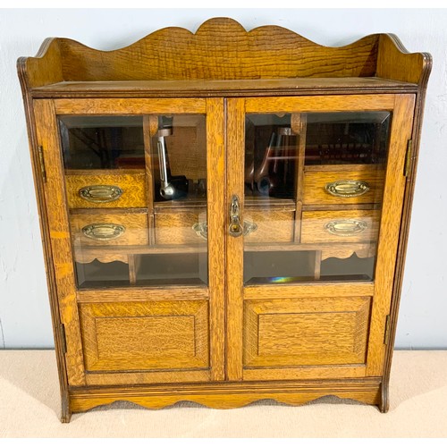 392 - OAK SMOKERS CABINET AND CONTENTS INCLUDING PIPES WIDTH 55cm . 62cm TALL