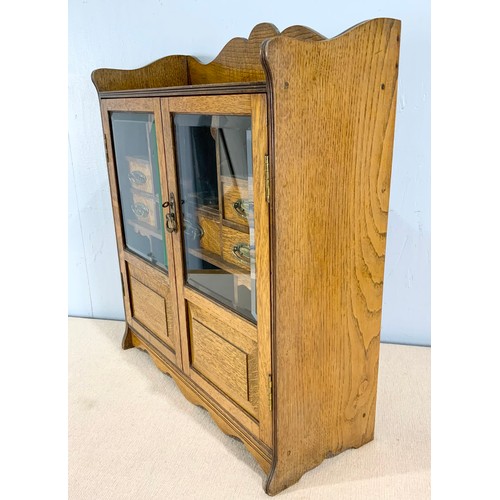 392 - OAK SMOKERS CABINET AND CONTENTS INCLUDING PIPES WIDTH 55cm . 62cm TALL